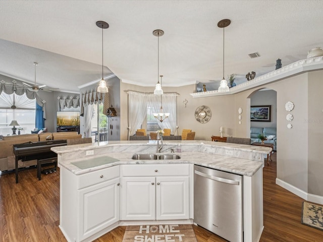 11144 Brambleleaf Way, Hudson, FL 34667 - kitchen featuring stainless steel dishwasher, open floor plan, arched walkways, wood finished floors, and crown molding