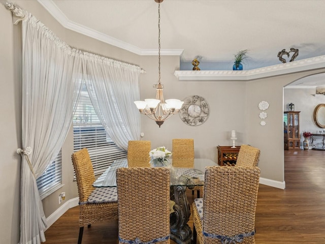 11144 Brambleleaf Way, Hudson, FL 34667 - dining room featuring arched walkways, a chandelier, ornamental molding, and wood finished floors