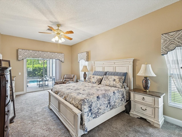 11144 Brambleleaf Way, Hudson, FL 34667 - bedroom with access to outside, carpet floors, multiple windows, and a textured ceiling