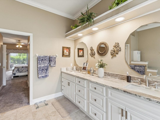 11144 Brambleleaf Way, Hudson, FL 34667 - ensuite bathroom with double vanity, ornamental molding, a ceiling fan, and tile patterned floors