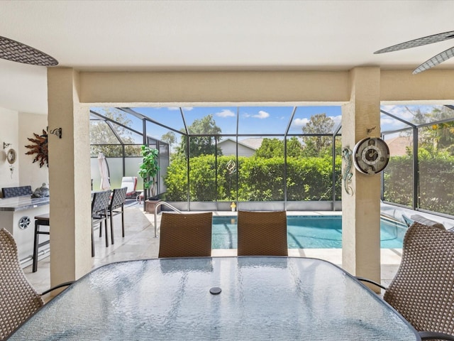 11144 Brambleleaf Way, Hudson, FL 34667 - outdoor pool with outdoor dining space, a patio area, and glass enclosure