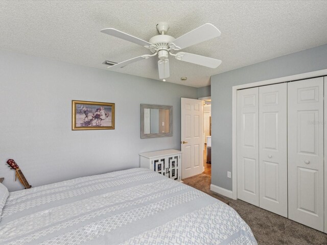 11144 Brambleleaf Way, Hudson, FL 34667 - bedroom with carpet, a closet, ceiling fan, and a textured ceiling