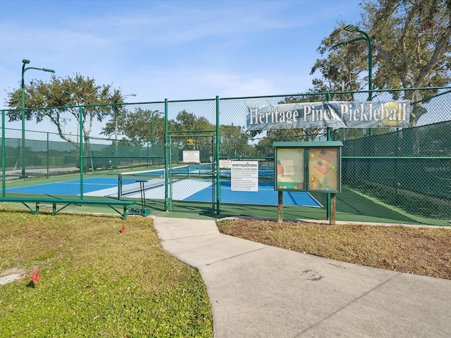 11144 Brambleleaf Way, Hudson, FL 34667 - view of tennis court with a gate