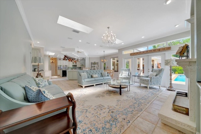 7275 Crystal Spring Run, Weeki Wachee, FL 34607 - living room featuring crown molding, a chandelier, a skylight, light tile patterned flooring, and french doors