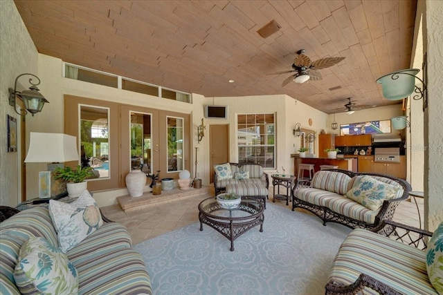 7275 Crystal Spring Run, Weeki Wachee, FL 34607 - tiled living room featuring wood ceiling, french doors, and ceiling fan