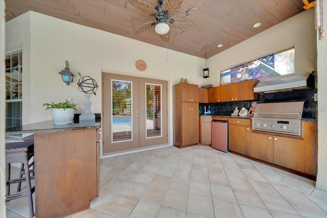 7275 Crystal Spring Run, Weeki Wachee, FL 34607 - kitchen featuring fridge, wall chimney range hood, a ceiling fan, french doors, and wooden ceiling