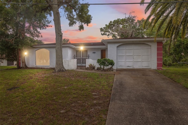 8340 Saint Marks Ct, Hudson, FL 34667 - single story home with stucco siding, driveway, a garage, and a yard