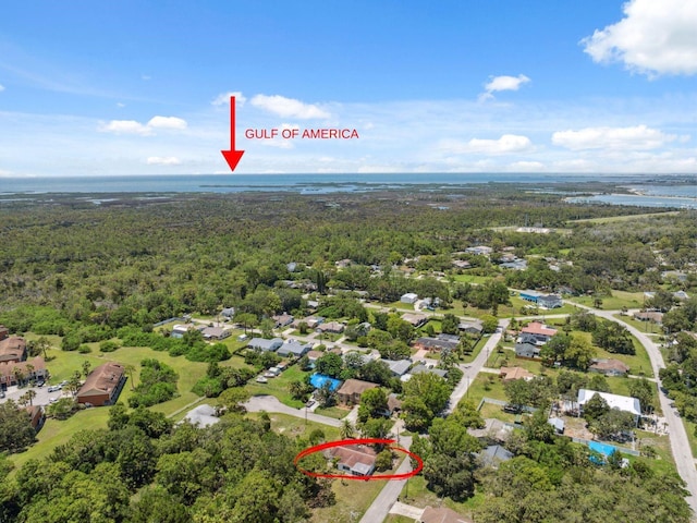 8340 Saint Marks Ct, Hudson, FL 34667 - aerial view of residential area featuring a heavily wooded area and a large body of water
