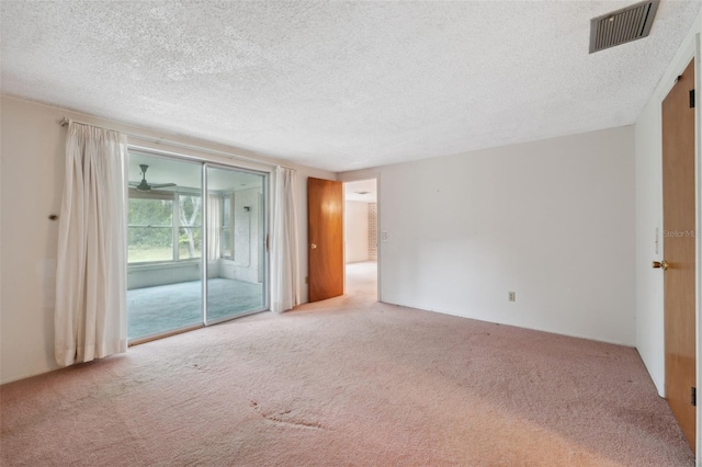 8340 Saint Marks Ct, Hudson, FL 34667 - carpeted empty room featuring a textured ceiling