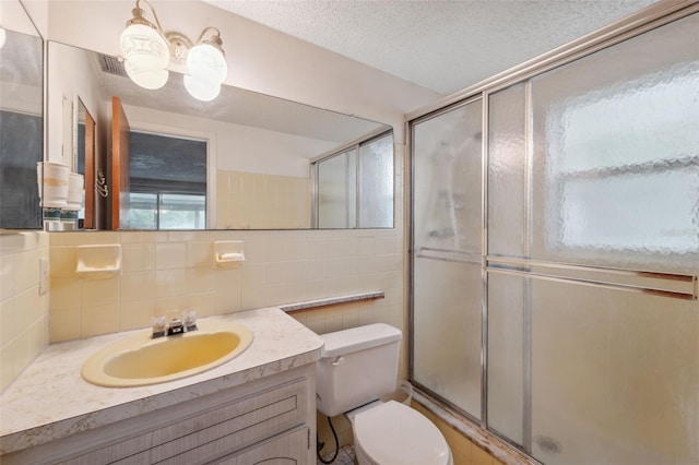 8340 Saint Marks Ct, Hudson, FL 34667 - full bath with a shower with door, vanity, decorative backsplash, tile walls, and a chandelier