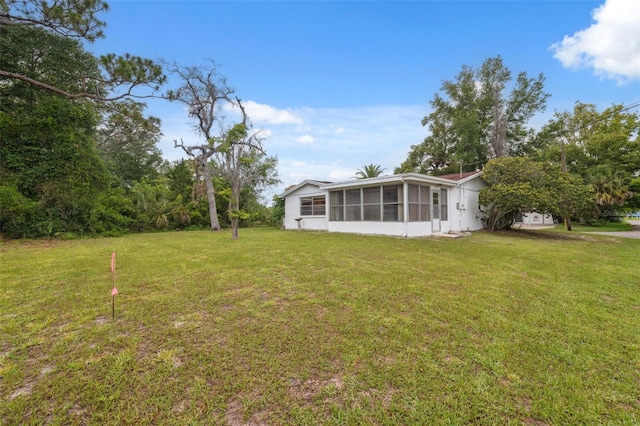 8340 Saint Marks Ct, Hudson, FL 34667 - view of grassy yard featuring a sunroom