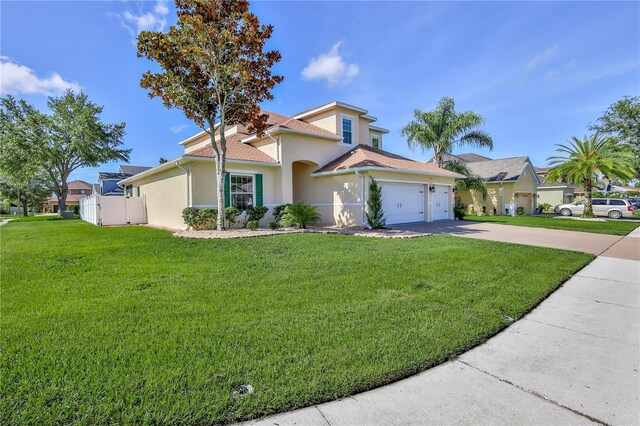 13772 Dunwoody Dr, Spring Hill, FL 34609 - mediterranean / spanish-style home with stucco siding, driveway, and an attached garage