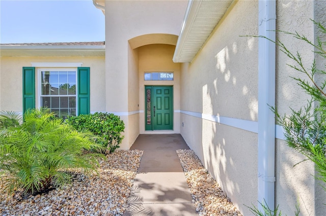 13772 Dunwoody Dr, Spring Hill, FL 34609 - doorway to property with stucco siding