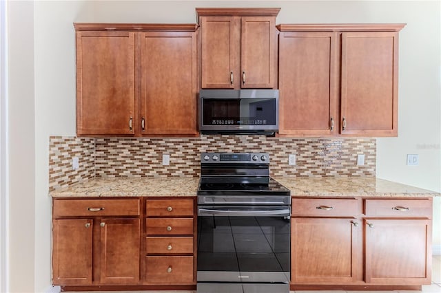 13772 Dunwoody Dr, Spring Hill, FL 34609 - kitchen featuring appliances with stainless steel finishes, decorative backsplash, light stone counters, and brown cabinets