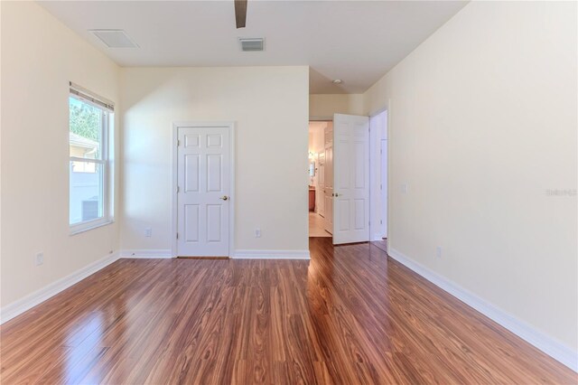 13772 Dunwoody Dr, Spring Hill, FL 34609 - unfurnished bedroom with wood finished floors and ceiling fan