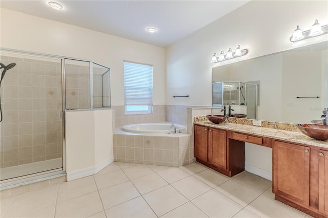 13772 Dunwoody Dr, Spring Hill, FL 34609 - bathroom featuring tile patterned flooring, a stall shower, a bath, and vanity