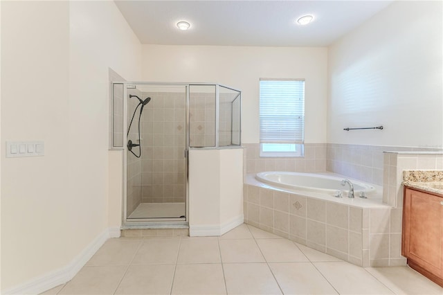 13772 Dunwoody Dr, Spring Hill, FL 34609 - bathroom with a garden tub, a stall shower, tile patterned flooring, and vanity