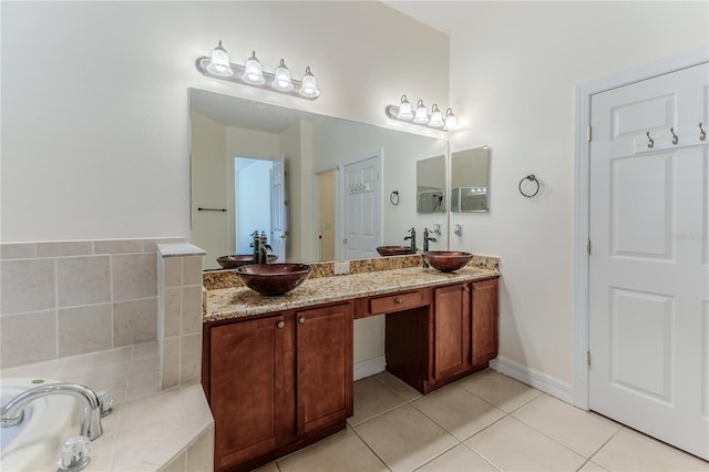 13772 Dunwoody Dr, Spring Hill, FL 34609 - bathroom featuring double vanity, tile patterned flooring, and a garden tub