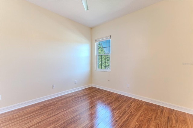 13772 Dunwoody Dr, Spring Hill, FL 34609 - empty room with wood finished floors and baseboards