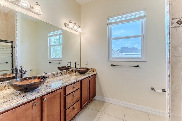 13772 Dunwoody Dr, Spring Hill, FL 34609 - bathroom with double vanity and tile patterned flooring