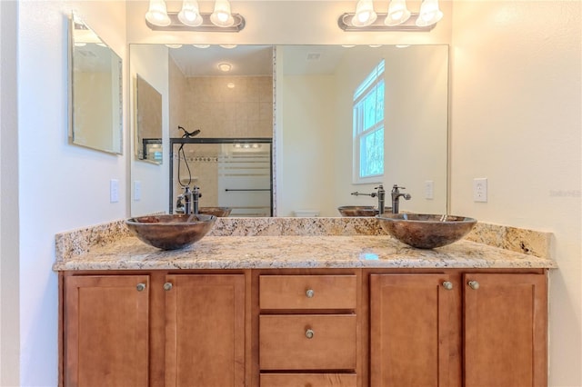 13772 Dunwoody Dr, Spring Hill, FL 34609 - bathroom featuring double vanity and a tile shower
