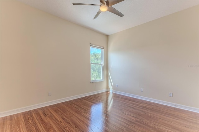 13772 Dunwoody Dr, Spring Hill, FL 34609 - empty room with wood finished floors and a ceiling fan