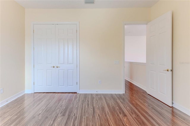13772 Dunwoody Dr, Spring Hill, FL 34609 - unfurnished bedroom featuring light wood finished floors and a closet