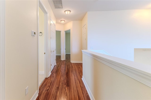 13772 Dunwoody Dr, Spring Hill, FL 34609 - hall featuring dark wood-type flooring and baseboards