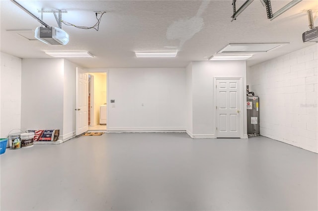 13772 Dunwoody Dr, Spring Hill, FL 34609 - garage featuring electric water heater, a garage door opener, washer / dryer, and concrete block wall