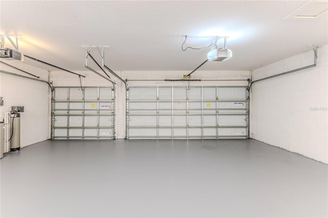 13772 Dunwoody Dr, Spring Hill, FL 34609 - garage with a garage door opener and concrete block wall