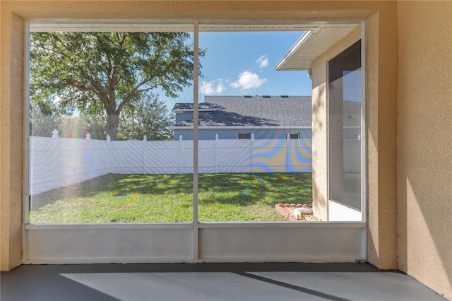13772 Dunwoody Dr, Spring Hill, FL 34609 - unfurnished sunroom featuring finished concrete floors