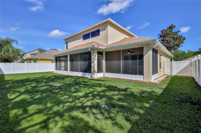 13772 Dunwoody Dr, Spring Hill, FL 34609 - back of house with a sunroom, a ceiling fan, a fenced backyard, and stucco siding