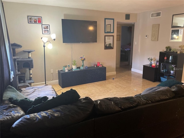 203 Pine Violet Ct Unit 202, Tampa, FL 33612 - tiled living room featuring baseboards