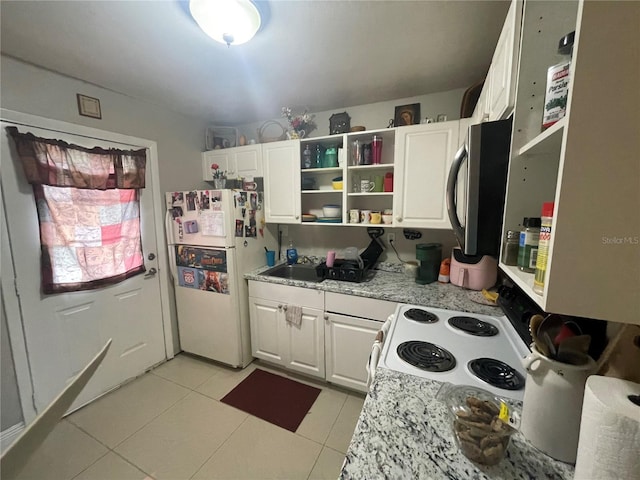 203 Pine Violet Ct Unit 202, Tampa, FL 33612 - kitchen featuring white appliances, light tile patterned floors, white cabinets, and open shelves