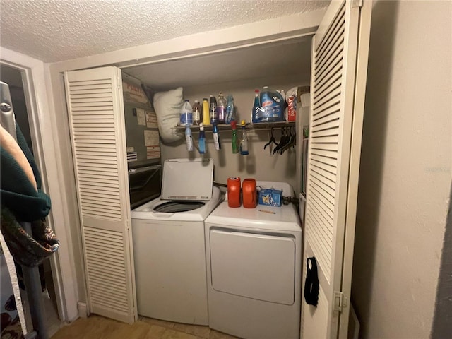 203 Pine Violet Ct Unit 202, Tampa, FL 33612 - washroom featuring washer and dryer and a textured ceiling