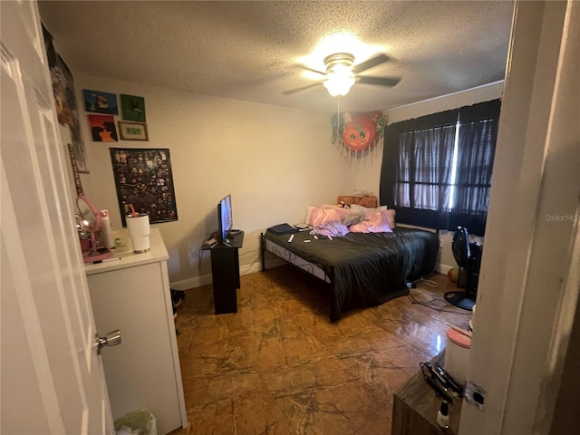 203 Pine Violet Ct Unit 202, Tampa, FL 33612 - bedroom with a textured ceiling and ceiling fan