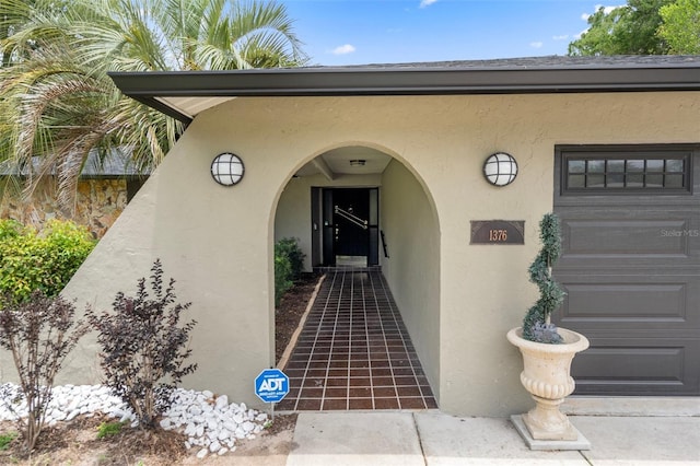 1376 Fayetteville Dr, Spring Hill, FL 34609 - doorway to property with stucco siding