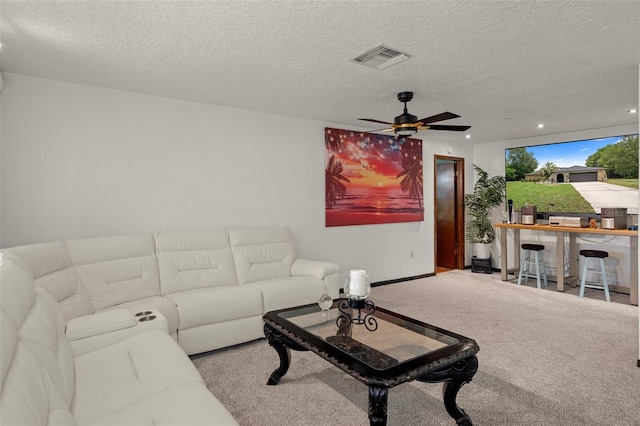 1376 Fayetteville Dr, Spring Hill, FL 34609 - carpeted living room featuring ceiling fan, a textured ceiling, and recessed lighting