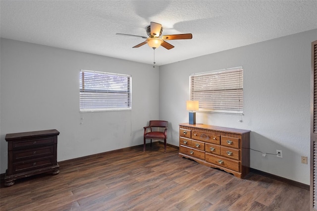 1376 Fayetteville Dr, Spring Hill, FL 34609 - bedroom with dark wood finished floors, a ceiling fan, and a textured ceiling