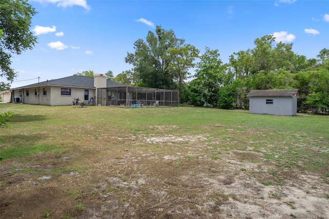 1376 Fayetteville Dr, Spring Hill, FL 34609 - view of green lawn featuring a storage shed and a lanai