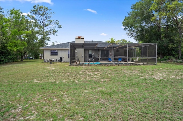 1376 Fayetteville Dr, Spring Hill, FL 34609 - back of property with a yard, a lanai, stucco siding, and a chimney
