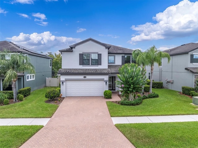 19326 Long Lake Ranch Blvd, Lutz, FL 33558 - traditional home with stucco siding, decorative driveway, a garage, and roof with shingles