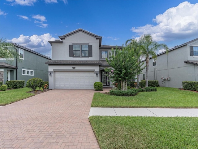 19326 Long Lake Ranch Blvd, Lutz, FL 33558 - traditional home featuring stucco siding, decorative driveway, a garage, and a front lawn