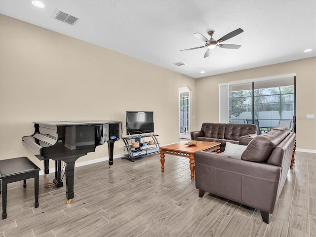19326 Long Lake Ranch Blvd, Lutz, FL 33558 - living area featuring light wood finished floors, ceiling fan, and recessed lighting