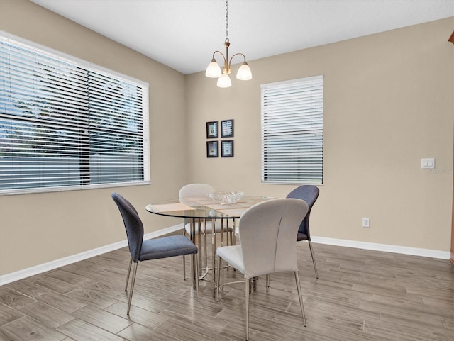 19326 Long Lake Ranch Blvd, Lutz, FL 33558 - dining area with wood finished floors and a chandelier