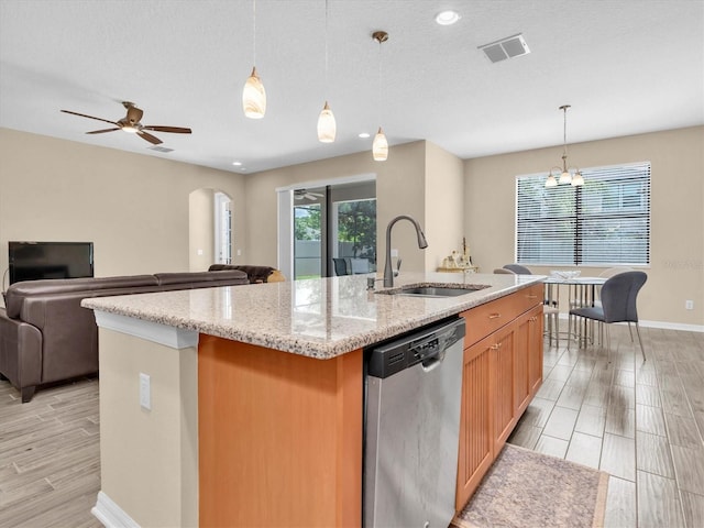 19326 Long Lake Ranch Blvd, Lutz, FL 33558 - kitchen featuring stainless steel dishwasher, a center island with sink, open floor plan, wood finish floors, and recessed lighting