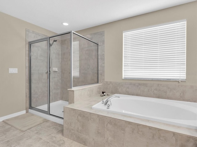 19326 Long Lake Ranch Blvd, Lutz, FL 33558 - full bathroom with a bath, a shower stall, and tile patterned flooring