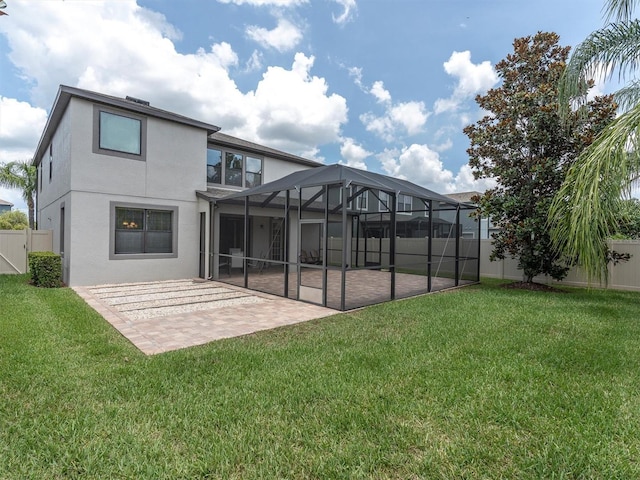 19326 Long Lake Ranch Blvd, Lutz, FL 33558 - back of property with a patio area, a fenced backyard, stucco siding, and a lanai