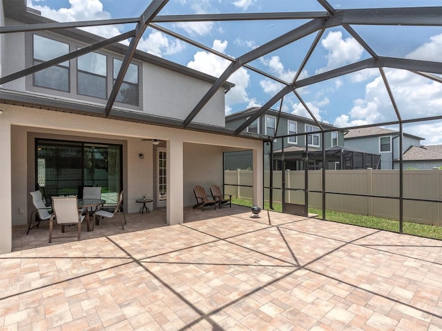 19326 Long Lake Ranch Blvd, Lutz, FL 33558 - view of patio / terrace with a lanai, a ceiling fan, and outdoor dining space