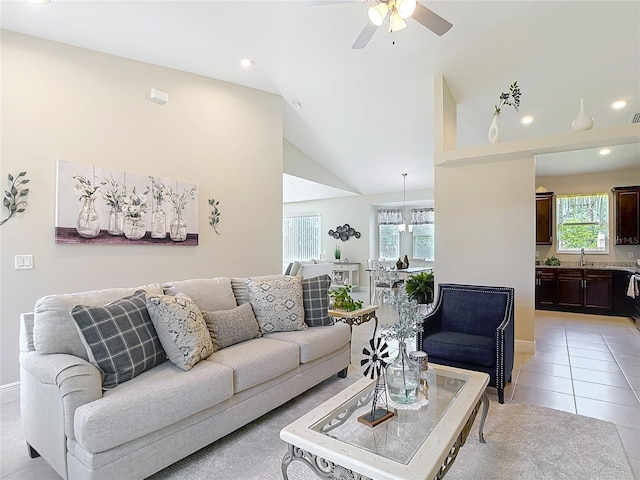 12323 House Finch, Weeki Wachee, FL 34614 - living area with plenty of natural light, a ceiling fan, vaulted ceiling, light tile patterned flooring, and recessed lighting
